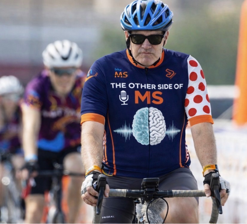 Casey cycling in Bike MS jersey